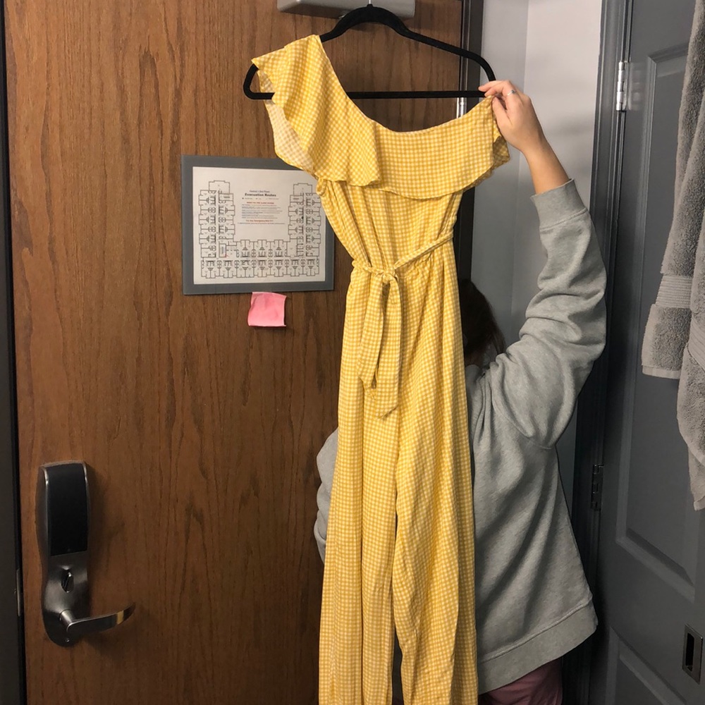 Yellow off the should jump suit